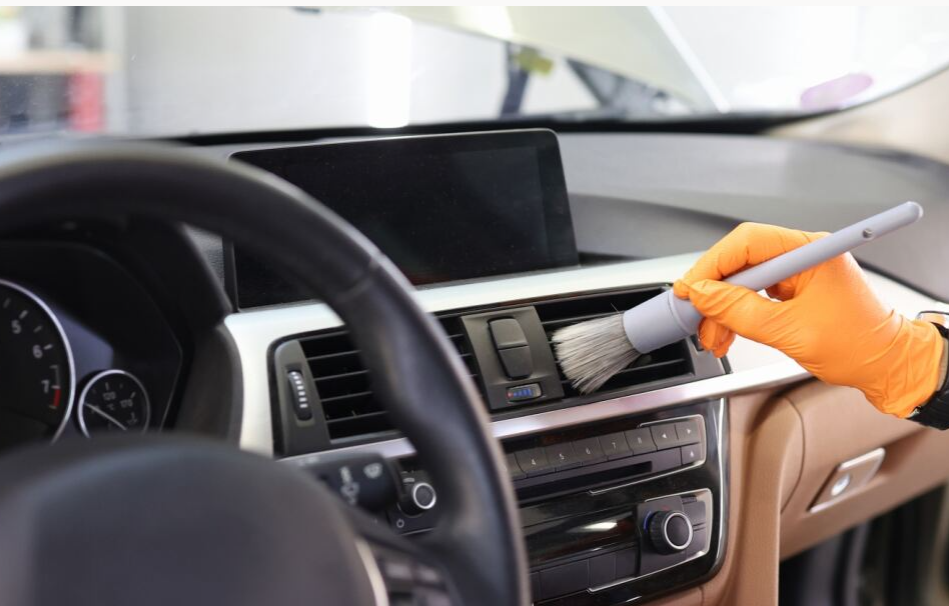Cleaning GMC Dashboard with Brush